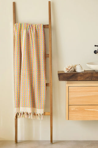 Mint Pink Turkish cotton pom pom towel hanging on a wooden ladder - VivaMaison