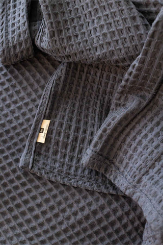 Anthracite waffle cotton bedspread styled bedroom view - long-staple Aegean cotton